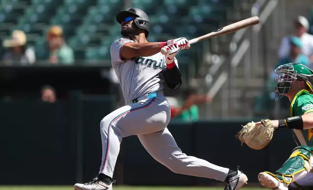 Miami Marlins' Otto Lopez hits a solo home run during the sixth inning of a baseball game against the Athletics Sunday, July 5, 2026, in West Sacramento, Calif. (AP Photo/Scott Marshall)