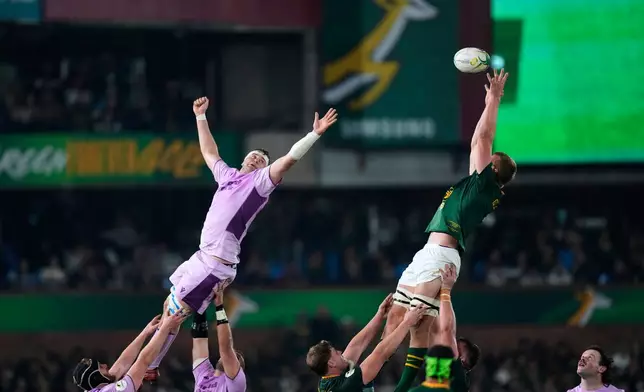 South Africa's captain Pieter-Steph du Toit, right, claims the ball in the lineout against Scotland's Scott Cummings during the Nations Championship Test rugby match between South Africa and Scotland, in Pretoria, Saturday, July 11, 2026. (AP Photo/Themba Hadebe)