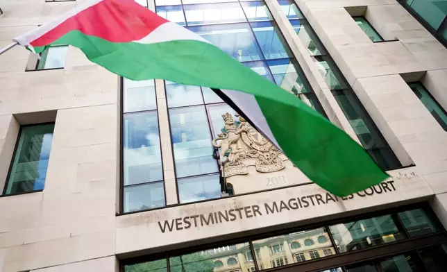 A Palestine flag waves outside the Westminster Magistrates Court, in London, Thursday, July 30, 2026.(AP Photo/Alberto Pezzali)