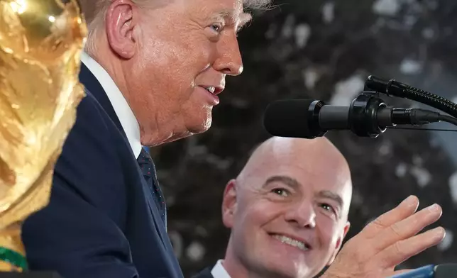 President Donald Trump speaks as FIFA President Gianni Infantino listens at a reception at Trump Tower in New York, Friday, July 17, 2026. (AP Photo/Jacquelyn Martin)