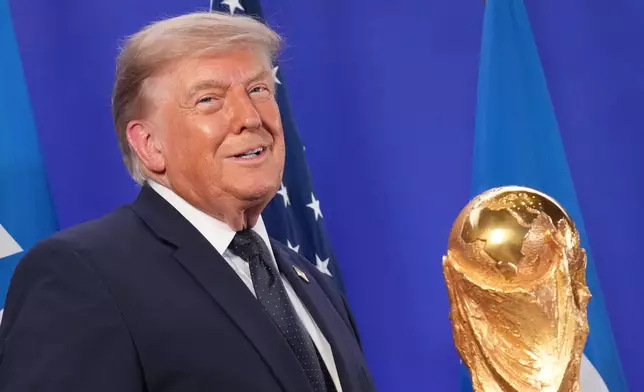 President Donald Trump listens as FIFA President Gianni Infantino speaks at a reception at Trump Tower in New York, Friday, July 17, 2026. (AP Photo/Jacquelyn Martin)