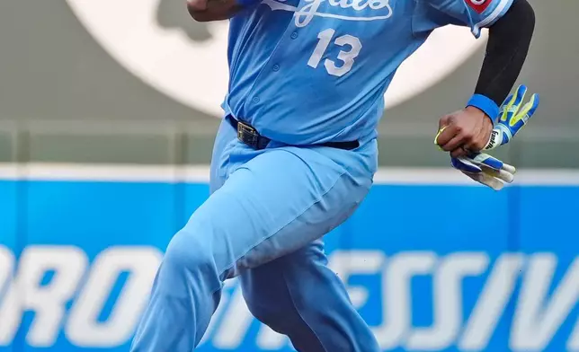 Kansas City Royals' Salvador Perez advances to third base from first on a single by Michael Massey against the Minnesota Twins in the second inning of a baseball game Wednesday, July 29, 2026, in Minneapolis. (AP Photo/Bruce Kluckhohn)