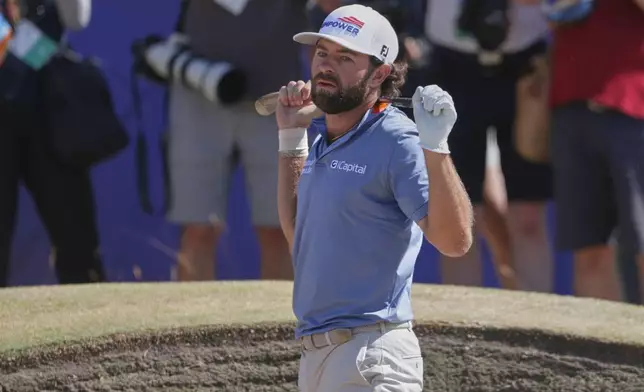 Cameron Young of the United States reacts after playing out of a bunker on the 18th green during the final day of the British Open Golf championships at Royal Birkdale golf club, in Southport, England, Sunday, July 19, 2026. (AP Photo/Peter Morrison)