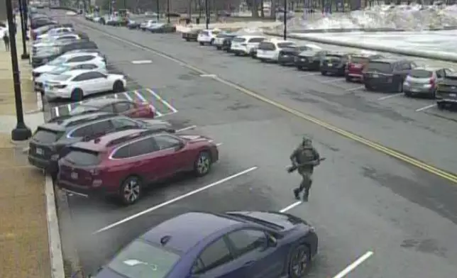This image from video contained in the Justice Department's memorandum in support of pretrial detention of Carter Camacho, 18, shows Camacho running near the U.S. Capitol in Washington, Feb. 17, 2026. (Justice Department via AP)