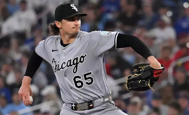Chicago White Sox starting pitcher Davis Martin (65) throws to a Toronto Blue Jays batter during first inning of a baseball game in Toronto, Saturday, July 18, 2026. (Jon Blacker/The Canadian Press via AP)