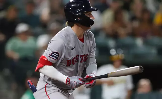 Boston Red Sox's Nick Sogard hits an RBI single during the sixth inning of a baseball game against the Athletics Wednesday, July 29, 2026, in West Sacramento, Calif. (AP Photo/Scott Marshall)