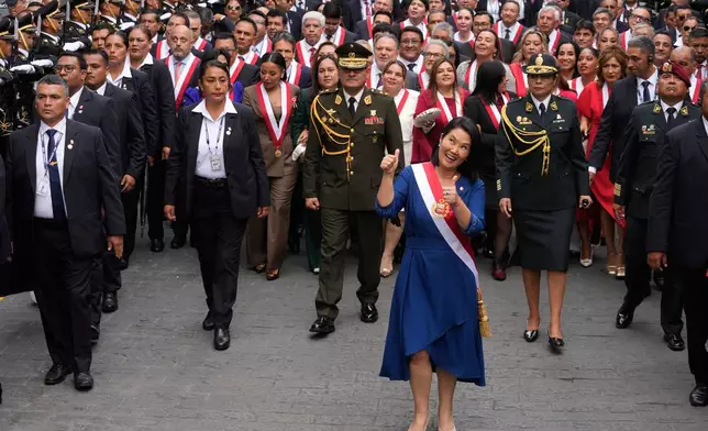 Peru's President Keiko Fujimori walks to the presidential palace after her inauguration in Lima, Peru, Tuesday, July 28, 2026. (AP Photo/Martin Mejia)