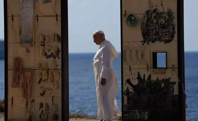 Pope Leo XIV visits the Gateway of Europe monument in Lampedusa, Sicily, southern Italy, Saturday, July 4, 2026, during a one-day pastoral visit to the island long associated with the plight of migrants crossing the Mediterranean. (AP Photo/Alessandra Tarantino)