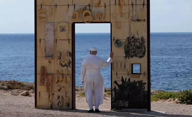Pope Leo XIV visits the Gateway of Europe monument in Lampedusa, Sicily, southern Italy, Saturday, July 4, 2026, during a one-day pastoral visit to the island long associated with the plight of migrants crossing the Mediterranean. (AP Photo/Alessandra Tarantino)