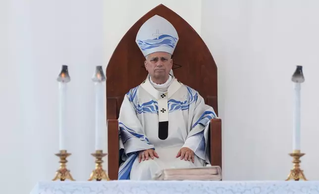 Pope Leo XIV celebrates Mass in Lampedusa, Sicily, southern Italy, Saturday, July 4, 2026, during a one-day pastoral visit to the Sicilian island that has come to symbolize the dramatic odyssey of migrants trying to reach Europe by sea. (AP Photo/Alessandra Tarantino)