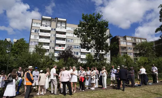 Members of the public queue for entry on day four of the Wimbledon Tennis Championships in London, Thursday, July 2, 2026. (Andrew Matthews/Pool Photo via AP)