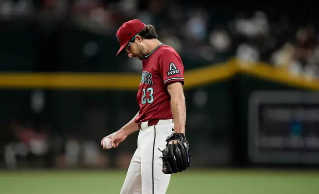 Arizona Diamondbacks starting pitcher Zac Gallen pauses on the pitcher's mound after giving up a two-run home against San Francisco Giants' Victor Bericoto during the fifth inning of a baseball game, Wednesday, July 1, 2026, in Phoenix. (AP Photo/Ross D. Franklin)