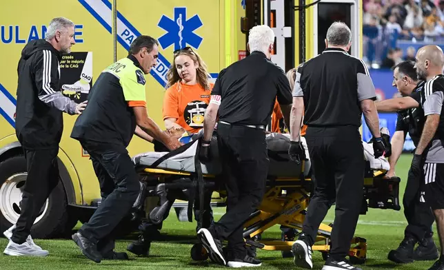 Inter Miami CF's German Berterame is stretchered off the pitch after colliding with CF Montreal's Efrain Morales during second half MLS soccer action in Montreal, on Saturday, July 25, 2026. (Graham Hughes/The Canadian Press via AP)
