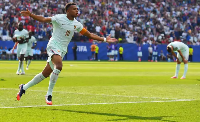 France's Kylian Mbappe (10) celebrates scoring the opening goal during the World Cup quarterfinal soccer match between France and Morocco in Foxborough, Mass., near Boston, Thursday, July 9, 2026. (AP Photo/Steven Senne)