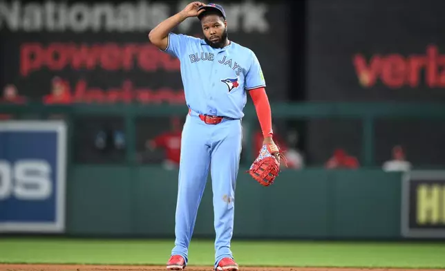 Toronto Blue Jays first baseman Vladimir Guerrero Jr. looks on during the first inning of a baseball game against the Washington Nationals, Tuesday, July 28, 2026, in Washington. (AP Photo/Nick Wass)