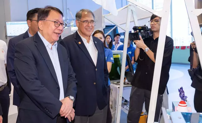 Chan Kwok-ki, Chief Secretary for Administration of the HKSAR Government (left) and Club Deputy Chairman Lester Huang (right) tour booths at the opening ceremony of youthfest@HK 2026.
