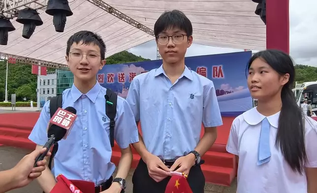 Students from Scientia Secondary School, Wang Zixuan, He Yumin, Tan Qianyu (from left to right), Photo by Bastille Post