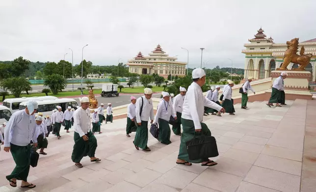 Myanmar’s lawmakers arrive to attend a regular session of the Union Parliament in Naypyitaw, Myanmar, Friday, July 31, 2026. (AP Photo/Aung Shine Oo)