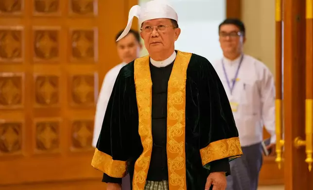 Parliament chairman Aung Lin Dwe, center, arrives to lead a regular session of the Union Parliament in Naypyitaw, Myanmar, Friday, July 31, 2026. (AP Photo/Aung Shine Oo)