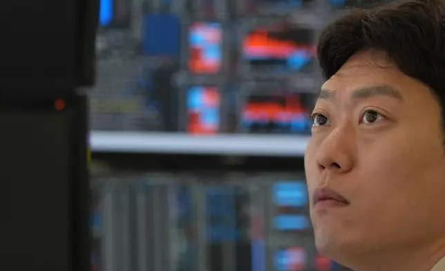 A dealer watches computer monitors at a dealing room of Hana Bank in Seoul, South Korea, Thursday, July 2, 2026. (AP Photo/Lee Jin-man)