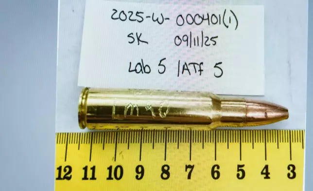 An image of a bullet casing engraved with "LMAO" is displayed during a preliminary hearing for Tyler Robinson, who is accused in the fatal shooting of Charlie Kirk, at the Fourth District Courthouse in Provo, Utah, Thursday, July 9, 2026. (AP Photo/Spenser Heaps, Pool)