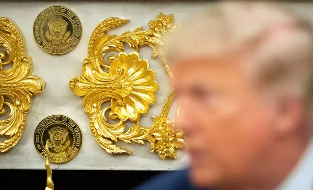 Gold-colored Presidential seals are seen on a fireplace in the Oval Office as President Donald Trump meets with Lebanese President Joseph Aoun at the White House, Tuesday, July 21, 2026, in Washington. (AP Photo/Mark Schiefelbein)