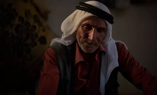 Youssef Moussa Shinaran, looks down as he talks about settlers attacks in his community near the West Bank village of Susya, in the Masafer Yatta region, Wednesday, June 17, 2026. "You're not allowed to move around. The house has become a prison," says the 52-year-old Palestinian. (AP Photo/Leo Correa)