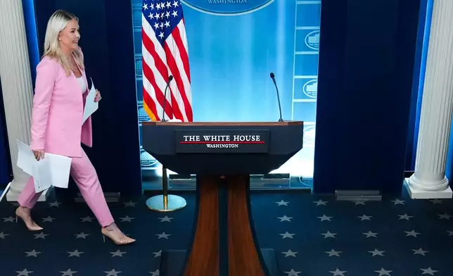 White House press secretary Karoline Leavitt arrives to speak with reporters in the James Brady Press Briefing Room at the White House, Thursday, July 16, 2026, in Washington. (AP Photo/Julia Demaree Nikhinson)