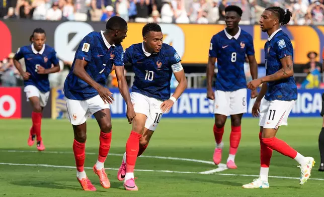 France's Kylian Mbappe, second right, celebrates with his teammates after scoring his side's opening goal during the World Cup round of 32 soccer match between France and Sweden in East Rutherford, N.J., near New York, Tuesday, June 30, 2026. (AP Photo/Seth Wenig)