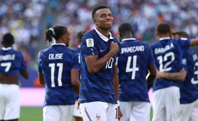 France's Kylian Mbappe (10) celebrates scoring their third goal during the World Cup round of 32 soccer match between France and Sweden in East Rutherford, N.J., near New York, Tuesday, June 30, 2026. (AP Photo/Pamela Smith)