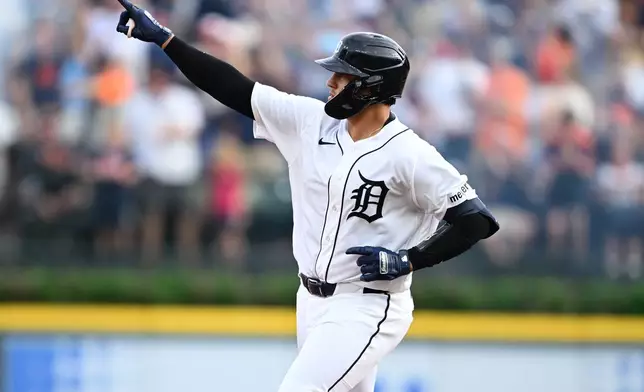 Detroit Tigers' Eduardo Valencia celebrates as he rounds the bases after hitting a solo home run against the Philadelphia Phillies in the fifth inning of a baseball game, Saturday, July 11, 2026, in Detroit. (AP Photo/Lon Horwedel)