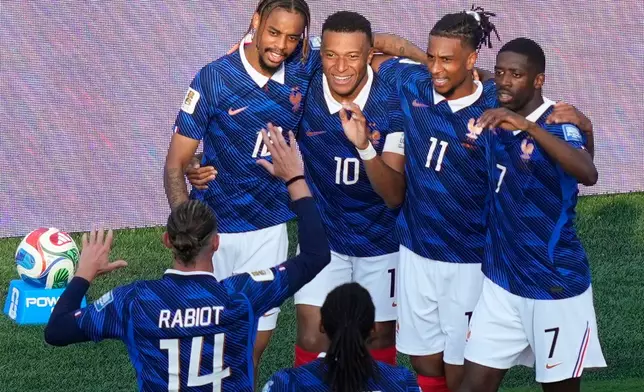 France's Kylian Mbappe (10) celebrates with teammates after scoring his side's third goal during the World Cup round of 32 soccer match between France and Sweden in East Rutherford, N.J., near New York, Tuesday, June 30, 2026. (AP Photo/Yuki Iwamura)