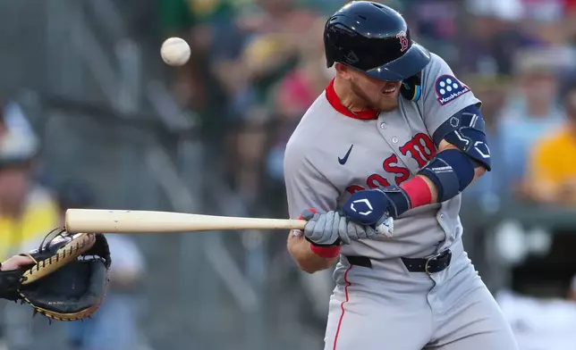 Boston Red Sox's Curtis Mead is hit by a pitch during the fourth inning of a baseball game against the Athletics, Monday, July 27, 2026, in West Sacramento, Calif. (AP Photo/Scott Marshall)