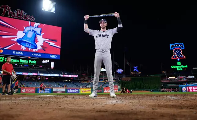 New York Yankees' Cody Bellinger poses with the MVP trophy after the MLB baseball All-Star Game between the American League and National League, Tuesday, July 14, 2026, in Philadelphia. (AP Photo/Matt Slocum)