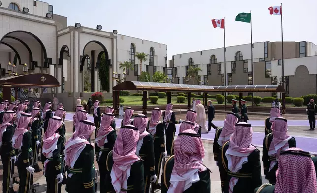 Canada Prime Minister Mark Carney walks with Saudi Arabia's Crown Prince Mohammed bin Salman as he arrives at the Royal Palace in Jeddah, Saudi Arabia, Thursday, July 9, 2026. (Adrian Wyld/The Canadian Press via AP)
