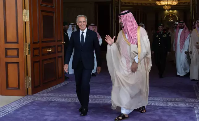 Canada Prime Minister Mark Carney, left, speaks with Saudi Arabia's Crown Prince Mohammed bin Salman as he leaves the Royal Palace in Jeddah, Saudi Arabia, Thursday, July 9, 2026. (Adrian Wyld/The Canadian Press via AP)