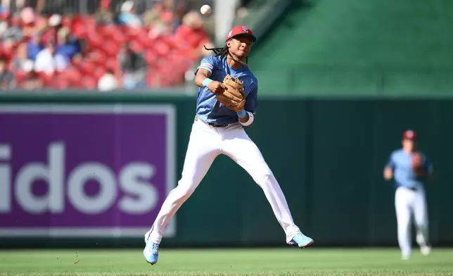 Washington Nationals shortstop CJ Abrams throws to first base but cannot get Arizona Diamondbacks' Ryan Waldschmidt who was safe with a single during the third inning of a baseball game, Saturday, July 25, 2026, in Washington. (AP Photo/Nick Wass)