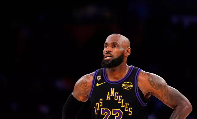 FILE - Los Angeles Lakers forward LeBron James stands on the court in the closing minutes of Game 4 in a second-round NBA basketball playoffs series against the Oklahoma City Thunder, May 11, 2026, in Los Angeles. (AP Photo/Mark J. Terrill, File)