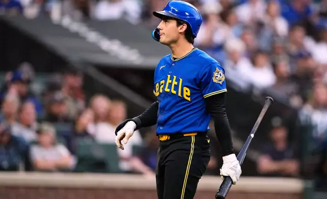Seattle Mariners' Cole Young react after striking out against the Toronto Blue Jays during the fifth inning of a baseball game, Friday, July 3, 2026, in Seattle. (AP Photo/Lindsey Wasson)