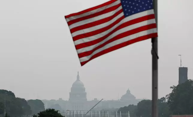 The U.S. Capitol is seen, as smoke from wildfires blankets the sky, Friday, July 17, 2026, in Washington. (AP Photo/Rahmat Gul)