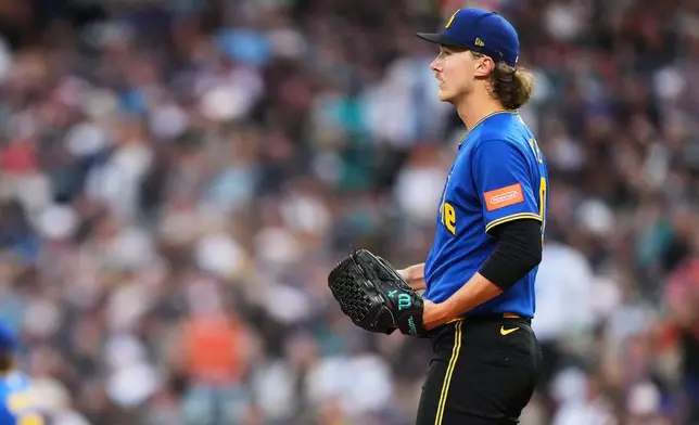 Seattle Mariners starting pitcher Bryce Miller reacts to a two-run home run by San Francisco Giants' Bryce Eldridge during the fifth inning of a baseball game, Friday, July 17, 2026, in Seattle. (AP Photo/Lindsey Wasson)