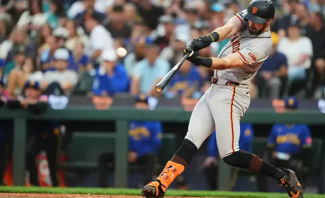 San Francisco Giants' Bryce Eldridge hits a two-run home run against the Seattle Mariners during the fifth inning of a baseball game, Friday, July 17, 2026, in Seattle. (AP Photo/Lindsey Wasson)