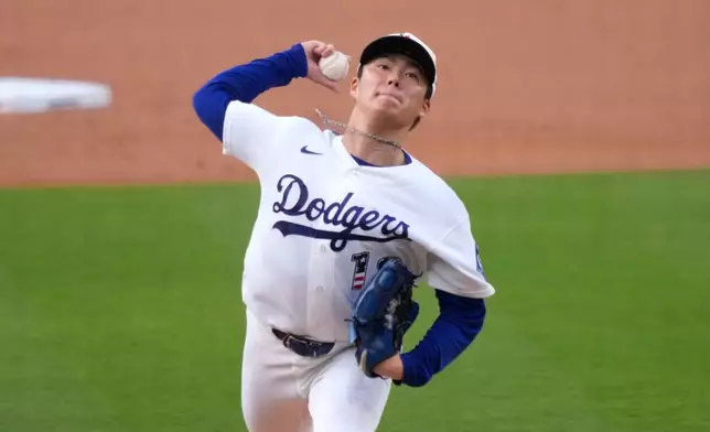 Los Angeles Dodgers starting pitcher Yoshinobu Yamamoto throws to the plate during the first inning of a baseball game against the San Diego Padres, Saturday, July 4, 2026, in Los Angeles. (AP Photo/Mark J. Terrill)