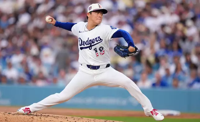 Los Angeles Dodgers starting pitcher Yoshinobu Yamamoto throws to the plate during the second inning of a baseball game against the San Diego Padres, Saturday, July 4, 2026, in Los Angeles. (AP Photo/Mark J. Terrill)