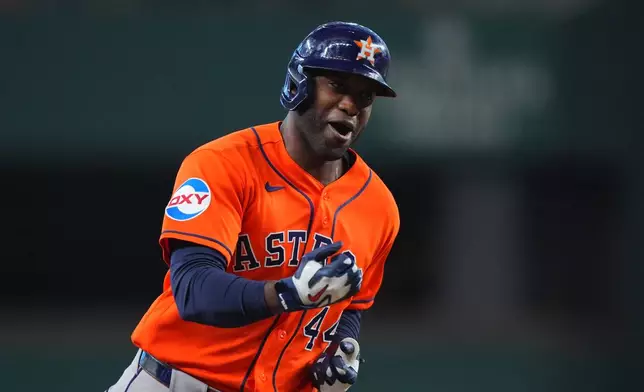 Houston Astros' Yordan Alvarez runs the bases after hitting a home run during the first inning of a baseball game against the Texas Rangers, Saturday, July 11, 2026, in Arlington, Texas. (AP Photo/LM Otero)