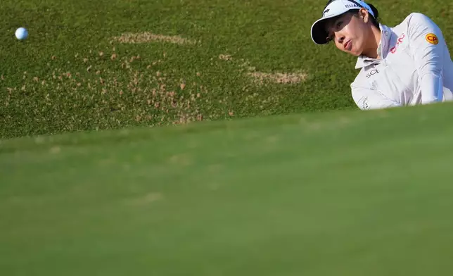 Jeeno Thitikul, of Thailand, plays a shot out of a bunker on the 3rd hole during the second round of the Women's British Open golf championship in Lytham St Annes, England, Friday, July 31, 2026. (AP Photo/Jon Super)