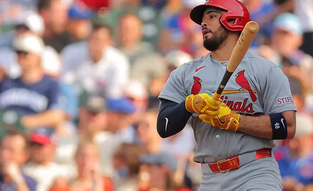 St. Louis Cardinals' Nelson Velázquez hits his two-RBI single during the sixth inning of a baseball game against the Chicago Cubs, Friday, July 3, 2026, in Chicago. (AP Photo/Melissa Tamez)