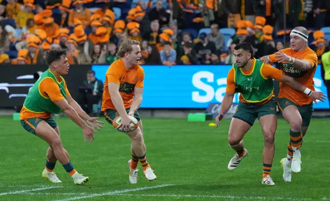 Australia's Max Jorgensen, second left passes the ball during the warm up ahead of the Nations Championship rugby international between Australia and Ireland in Sydney, Saturday July, 4, 2026. (AP Photo/Mark Baker)