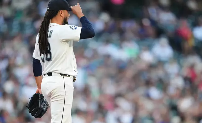 Seattle Mariners starting pitcher Luis Castillo looks on after giving up a solo home run to Cincinnati Reds' Eugenio Suárez during the fourth inning of a baseball game, Tuesday, July 21, 2026, in Seattle. (AP Photo/Lindsey Wasson)