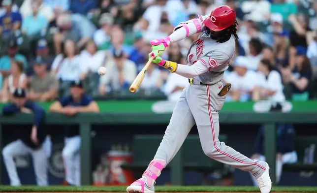 Cincinnati Reds' Elly De La Cruz hits a solo home run against the Seattle Mariners during the first inning of a baseball game, Tuesday, July 21, 2026, in Seattle. (AP Photo/Lindsey Wasson)